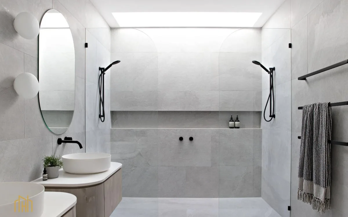 Detail of a beautifully tiled shower niche, demonstrating intelligent, built-in storage solutions.