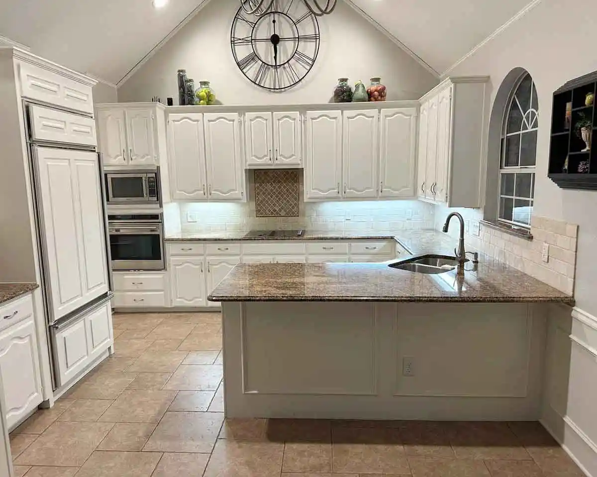 Outdated kitchen in Plano, TX before remodeling with old countertops and original backsplash