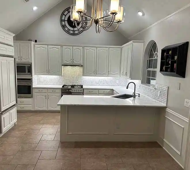 Modern remodeled kitchen in Plano, TX with new white countertops, updated backsplash, and bright lighting
